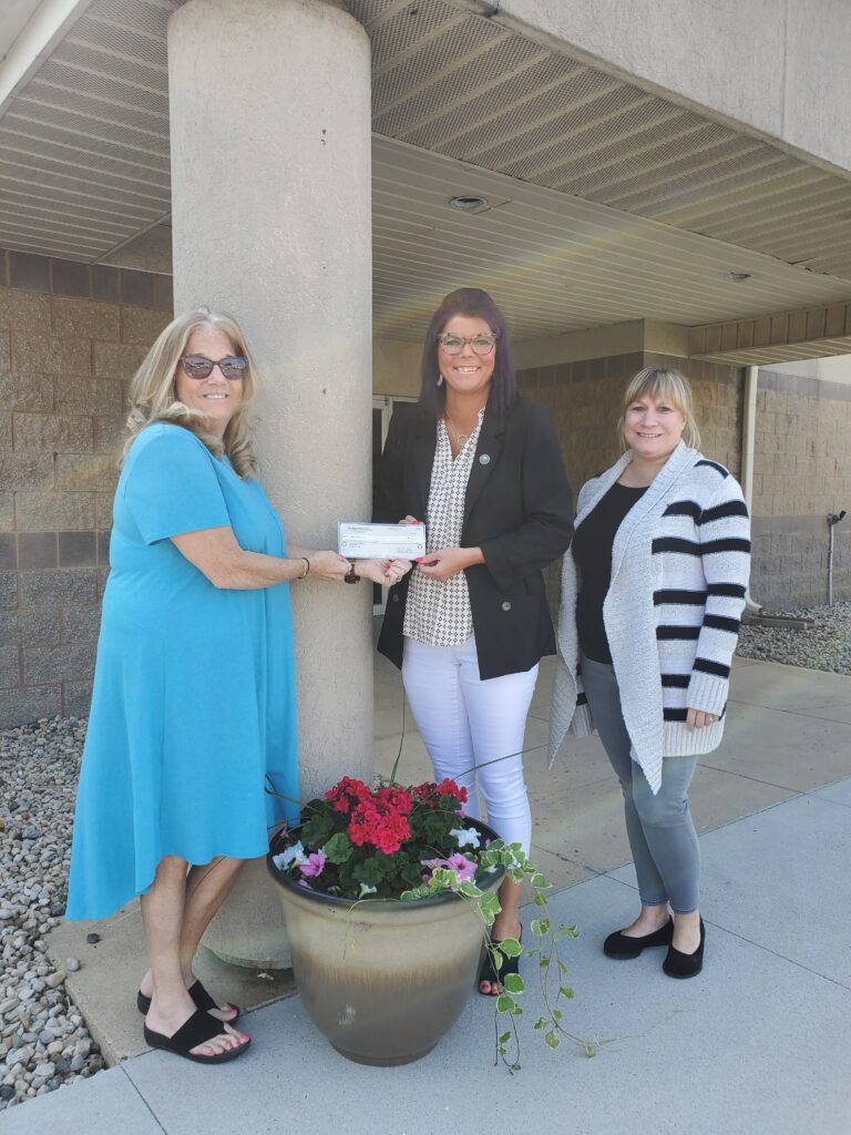 ECIRPD presenting check to Heart & Hands United